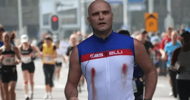 a picture of a male marathon runner's nipples that are torn and bleeding