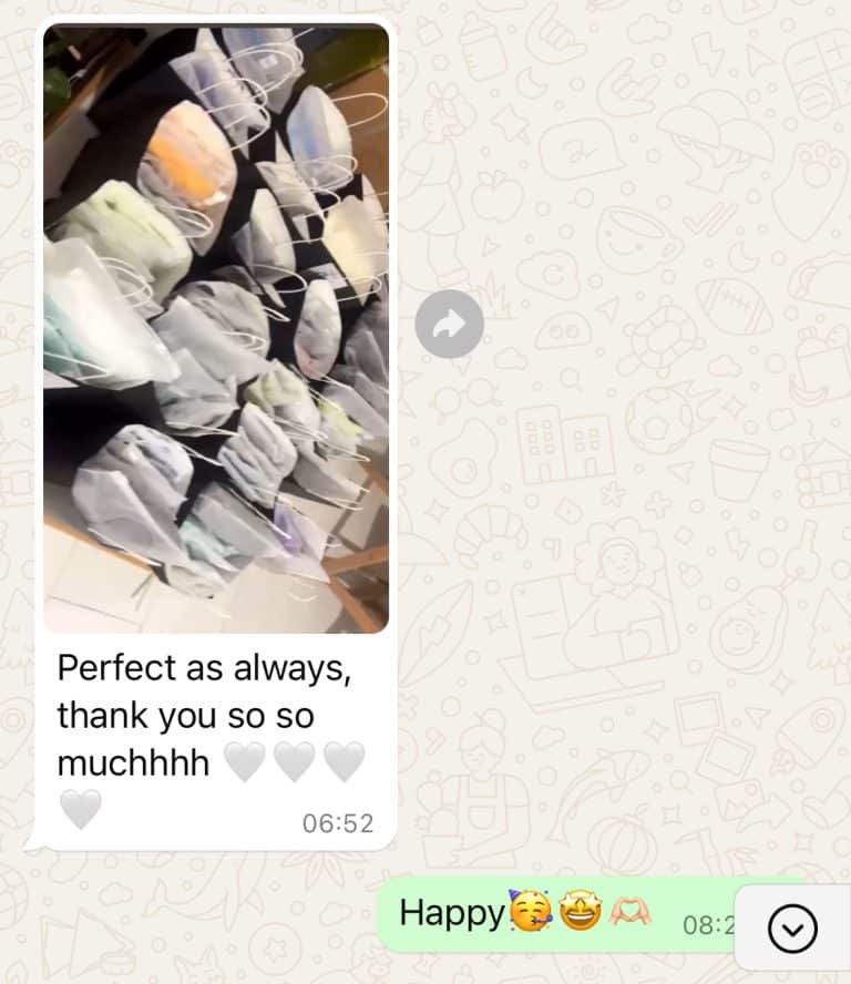 Bulk activewear shipment neatly packed in polybags. Customer feedback stating 'perfect as always' regarding manufacturing consistency.