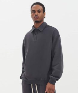 Male model wearing a high-quality, grey slim fit hoodie from a China-based manufacturer, showcasing its modern, athletic cut.