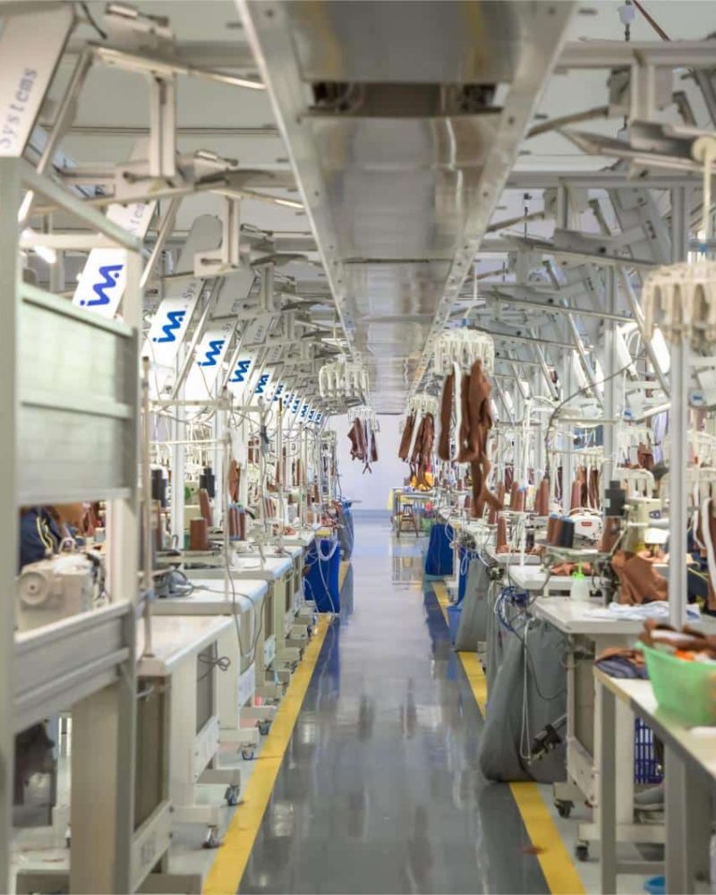 Close-up view of Maes Group's advanced cut & sew production line featuring a smart overhead hanging system for maximum manufacturing efficiency.